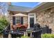 Cozy outdoor patio featuring a dining table, chairs, grill, and a charming fenced-in area at 744 Ledgestone Ct, Tega Cay, SC 29708