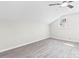 Bright bedroom with a neutral palette, hardwood floors, and a window offering natural light at 7816 Wallace Ln, Charlotte, NC 28212