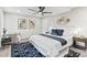 Comfortable bedroom showcasing stylish decor, ceiling fan and natural light at 7816 Wallace Ln, Charlotte, NC 28212