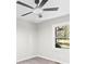 Bright and airy bedroom with a ceiling fan and a view of the outside at 7816 Wallace Ln, Charlotte, NC 28212