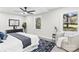 Bright bedroom featuring a ceiling fan, large windows, and neutral decor at 7816 Wallace Ln, Charlotte, NC 28212