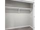 A bright, open closet with a clean shelf and wooden floors at 7816 Wallace Ln, Charlotte, NC 28212