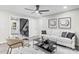 Bright living room with a stylish sofa, modern artwork, and a sleek coffee table at 7816 Wallace Ln, Charlotte, NC 28212