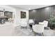 Cozy living room featuring modern decor, stylish seating, and unique wall accents at 7816 Wallace Ln, Charlotte, NC 28212