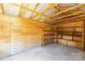 An open storage shed with exposed beams and custom shelving at 7816 Wallace Ln, Charlotte, NC 28212