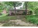 The back of the house showing a well maintained lawn and brick construction at 783 Carpenter Ave, Mooresville, NC 28115