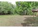 Large, grassy backyard with mature trees at 783 Carpenter Ave, Mooresville, NC 28115