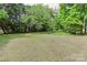 Large, grassy backyard with mature trees at 783 Carpenter Ave, Mooresville, NC 28115