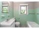 Retro bathroom featuring vintage green tile, a classic sink, and a charming bathtub at 783 Carpenter Ave, Mooresville, NC 28115