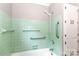 Bathroom featuring a tiled shower and safety grab bars at 783 Carpenter Ave, Mooresville, NC 28115