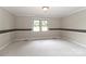 Bright bedroom featuring a large window, neutral walls, and carpeted floors at 783 Carpenter Ave, Mooresville, NC 28115