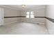 Bright bedroom featuring a large window, neutral walls, and carpeted floors at 783 Carpenter Ave, Mooresville, NC 28115
