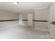 Bedroom with neutral walls, carpet, white trim, crown moulding, and two white doors at 783 Carpenter Ave, Mooresville, NC 28115
