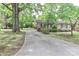 Charming single-story home with a long driveway and mature trees at 783 Carpenter Ave, Mooresville, NC 28115