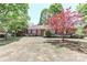 Lovely brick home with manicured bushes and a striking red tree enhancing its appeal at 783 Carpenter Ave, Mooresville, NC 28115