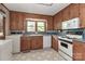 Classic kitchen with wood cabinets, white appliances, and blue countertops at 783 Carpenter Ave, Mooresville, NC 28115