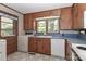 Classic kitchen with wood cabinets, white appliances, and blue countertops at 783 Carpenter Ave, Mooresville, NC 28115
