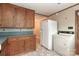 Classic kitchen with wood cabinets, white appliances, and blue countertops at 783 Carpenter Ave, Mooresville, NC 28115