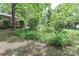 Lush landscaping and mature trees surround the property, enhancing its curb appeal and creating a serene atmosphere at 783 Carpenter Ave, Mooresville, NC 28115
