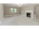 A living room that features a ceiling fan and a fireplace at 783 Carpenter Ave, Mooresville, NC 28115