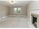 Living room with a fireplace and neutral colored walls at 783 Carpenter Ave, Mooresville, NC 28115