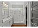 Modern bathroom with marble shower, dual showerheads, and elegant fixtures at 806 Sunnyside Ave, Charlotte, NC 28204