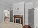 Charming bedroom featuring a decorative fireplace, hardwood floors and crown molding at 806 Sunnyside Ave, Charlotte, NC 28204