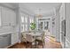 Charming breakfast nook with banquette seating and natural light from the sliding glass doors at 806 Sunnyside Ave, Charlotte, NC 28204