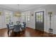 Bright dining room with a glass table, six upholstered chairs, and ample light at 806 Sunnyside Ave, Charlotte, NC 28204