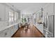 Beautiful kitchen with stainless steel appliances, hardwood floors, and bright breakfast nook at 806 Sunnyside Ave, Charlotte, NC 28204