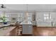 Kitchen and living room featuring pendant lights and a kitchen island with bar stools at 806 Sunnyside Ave, Charlotte, NC 28204