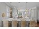 Open-concept kitchen with quartz counters, pendant lighting, and island with seating at 806 Sunnyside Ave, Charlotte, NC 28204