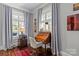 Cozy office space featuring hardwood floors, wood desk, chair, and natural light from the windows at 806 Sunnyside Ave, Charlotte, NC 28204