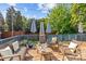 A welcoming patio with comfortable seating, outdoor heaters and blue umbrellas at 806 Sunnyside Ave, Charlotte, NC 28204