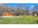 Expansive backyard with a two-car garage and wooden outbuilding at 8194 Mallard Rd, Denver, NC 28037
