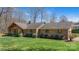 Charming brick home with a well-maintained lawn and inviting front porch at 8194 Mallard Rd, Denver, NC 28037