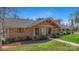 Beautiful brick home with a welcoming porch and lush green lawn at 8194 Mallard Rd, Denver, NC 28037