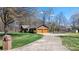 Property featuring a long driveway leading to a two-car garage and waterfront access at 8194 Mallard Rd, Denver, NC 28037