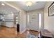 Inviting foyer featuring hardwood floors, and access to the kitchen at 8194 Mallard Rd, Denver, NC 28037