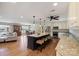 Open concept kitchen with island seating, stainless appliances, granite counters, and hardwood floors at 8194 Mallard Rd, Denver, NC 28037