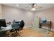 Home office setup with a desk, filing cabinets, hardwood floors and neutral wall paint at 8194 Mallard Rd, Denver, NC 28037
