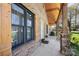 Welcoming front porch with stone accents and a view of the green yard at 8194 Mallard Rd, Denver, NC 28037
