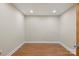 A versatile room showcasing neutral walls, recessed lighting, and wood-look floors, perfect for an office or den at 8194 Mallard Rd, Denver, NC 28037