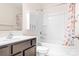 Cozy bathroom with decorative shower curtain, classic vanity, and ample storage at 9230 Avery Meadows Dr, Charlotte, NC 28216