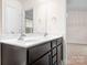 Stylish bathroom with double vanity sinks, dark wood cabinets, and modern fixtures, ideal for daily routines at 9230 Avery Meadows Dr, Charlotte, NC 28216