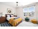 Cozy bedroom with a patterned rug and a comfortable seating area near the window at 9230 Avery Meadows Dr, Charlotte, NC 28216