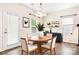 Charming dining room with a round table and modern lighting fixture at 9230 Avery Meadows Dr, Charlotte, NC 28216