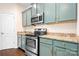 Modern kitchen features stainless steel appliances, stylish cabinets, and granite countertops at 9230 Avery Meadows Dr, Charlotte, NC 28216