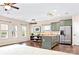 Open-concept kitchen featuring stainless steel appliances and a center island at 9230 Avery Meadows Dr, Charlotte, NC 28216