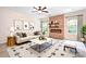 Bright living room with modern decor, fireplace, and stylish furniture at 9230 Avery Meadows Dr, Charlotte, NC 28216